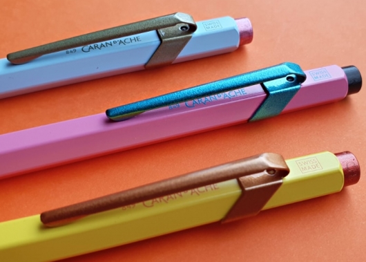 colourful pens in orange background