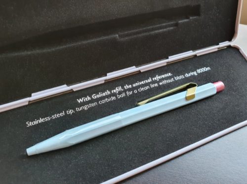 pen in an open metal case