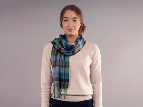 model wears tartan luxury scarf