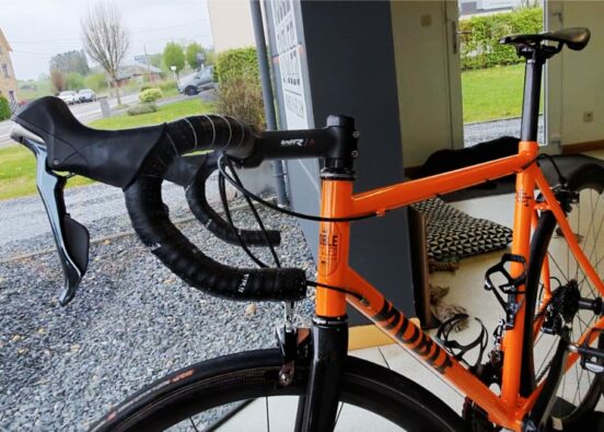 orange bicycle in a showroom