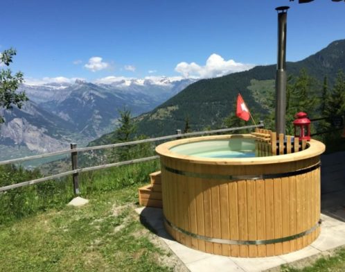 wooden hot tub in a mountains